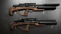 Две винтовки Jager SP Bullpup 6.35 мм одна над другой на серой стене